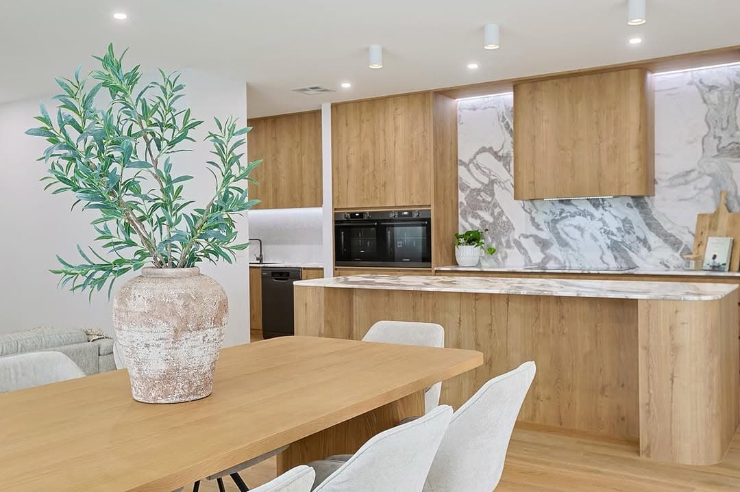 Premium staged living room with neutral styling and natural light